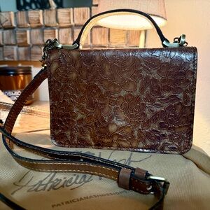 Elegant Brown Floral Embossed Handbag by Patricia Nash